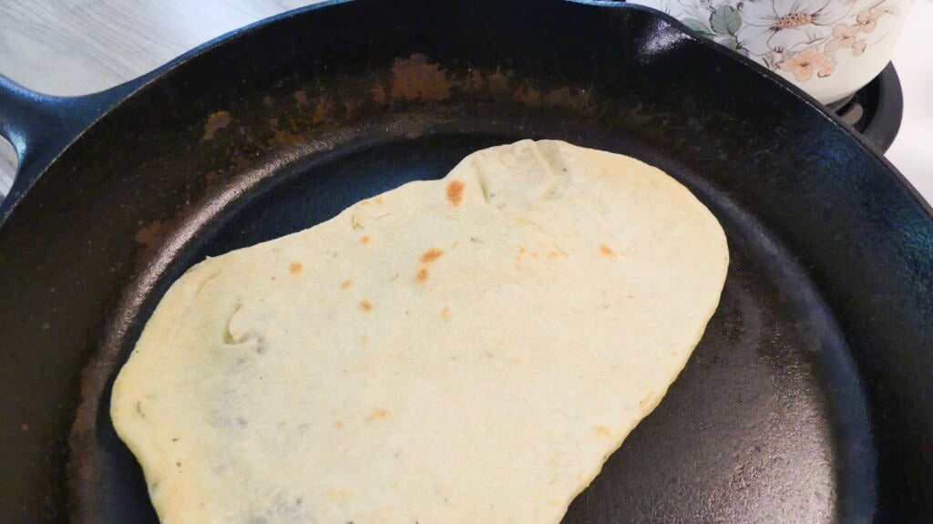 sourdough flat bread in a cast iron skillet