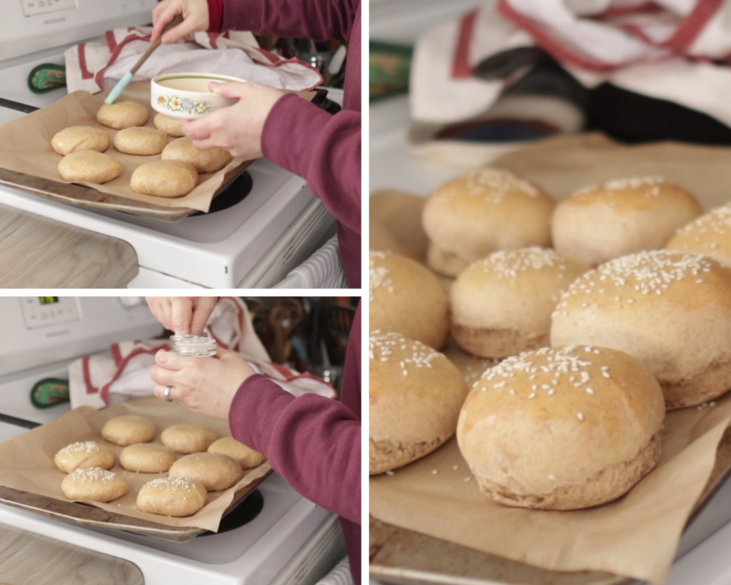 3 photo collage for making fresh milled hamburger buns. 1. adding an egg wash on top of the buns with a pastry brush, 2. adding sesame seeds to the top of the buns, 3. the finished buns on a parchment paper lined baking sheet.