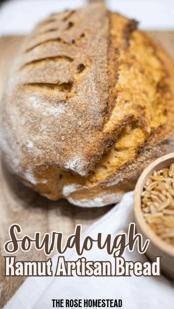 This is a pinterest pin for sourdough kamut artisan bread. There is a photo of the golden brown loaf of bread on a cutting board with text that reads sourdough kamut artisan bread.