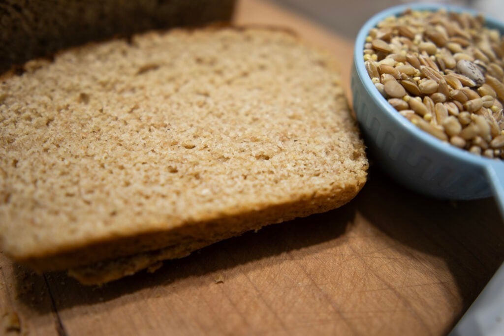 Slice of Ezekiel Bread on cutting board