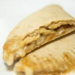 calzone cut in half on a plate