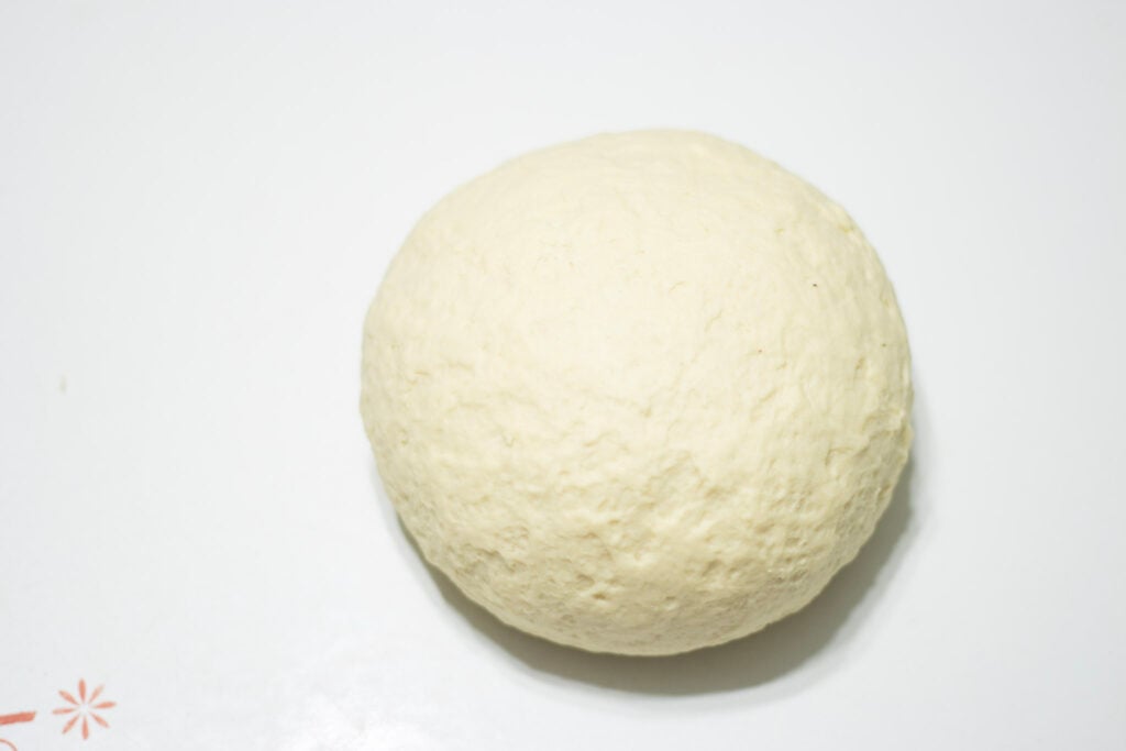 ball of dough resting on counter