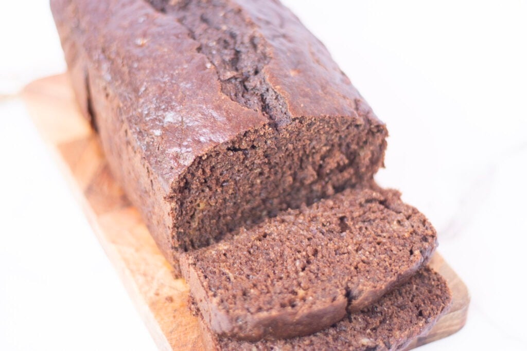 chocolate banana bread sliced on cutting board