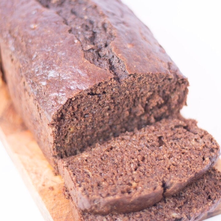 chocolate banana bread sliced on cutting board