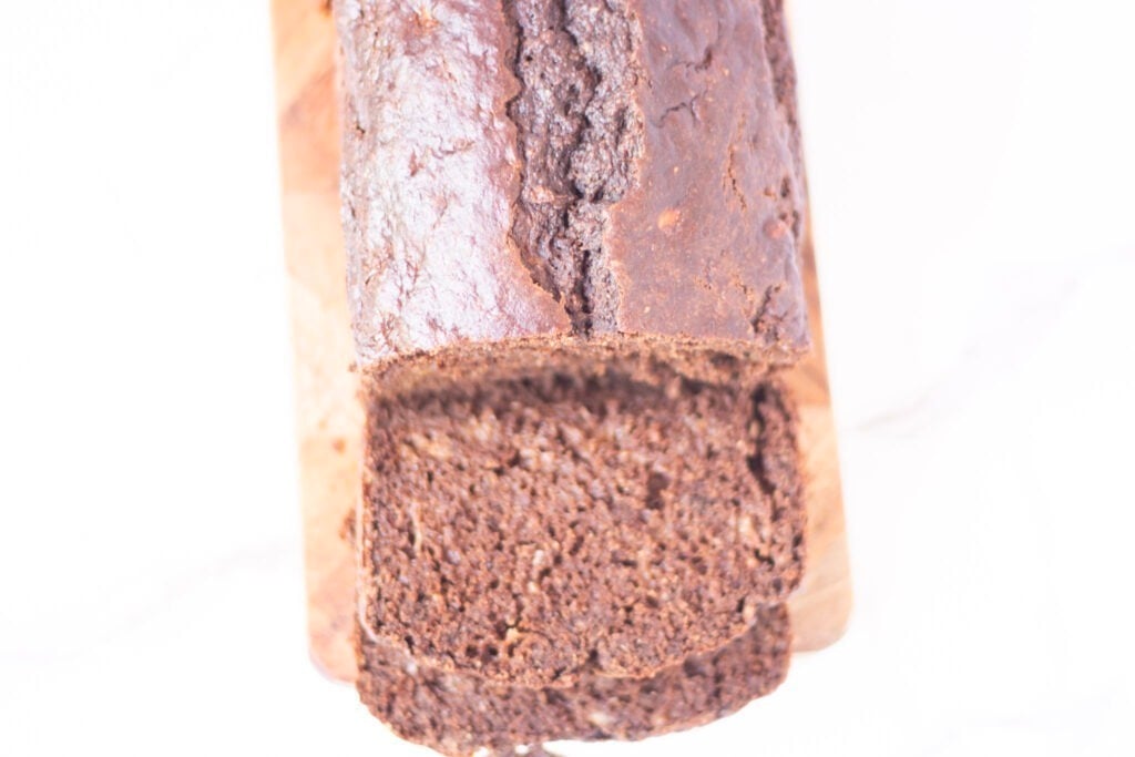 chocolate banana bread with one slice in foreground