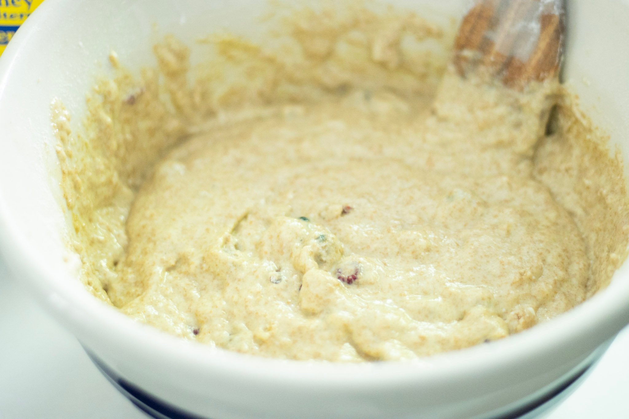 sourdough discard raspberry muffin batter in a bowl