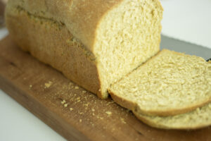 bread on cutting board with 2 slices