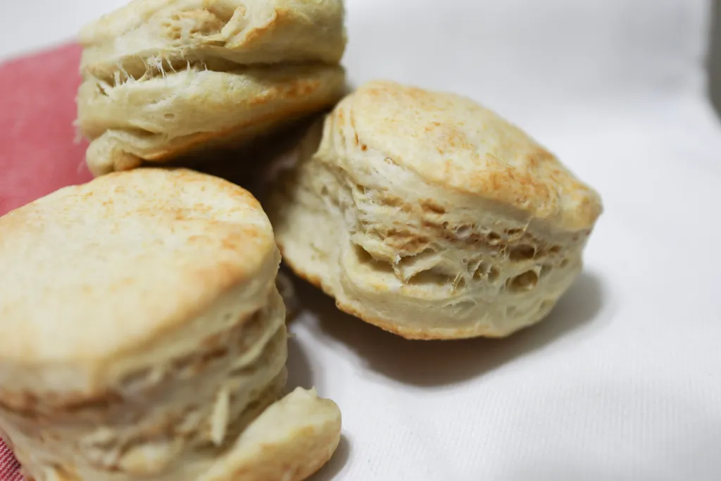 3 sourdough biscuits showing the flakiness of the biscuit.