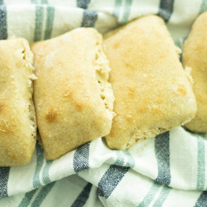 sourdough ciabatta laid out on a blue and white towel