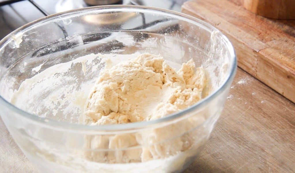 the dumpling dough mixed in a glass bowl