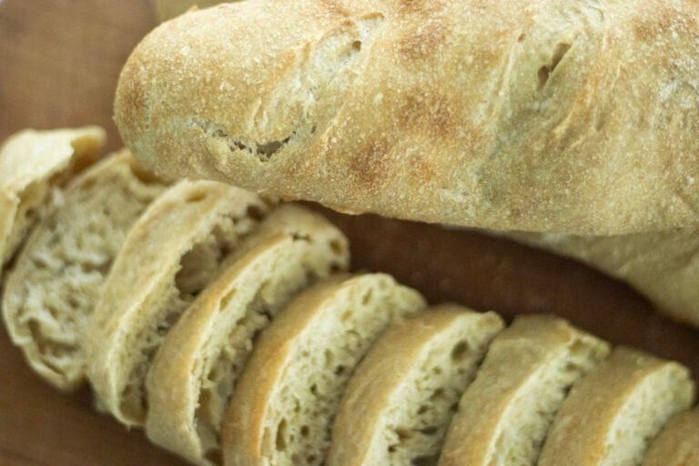 sourdough baguettes on a cutting board