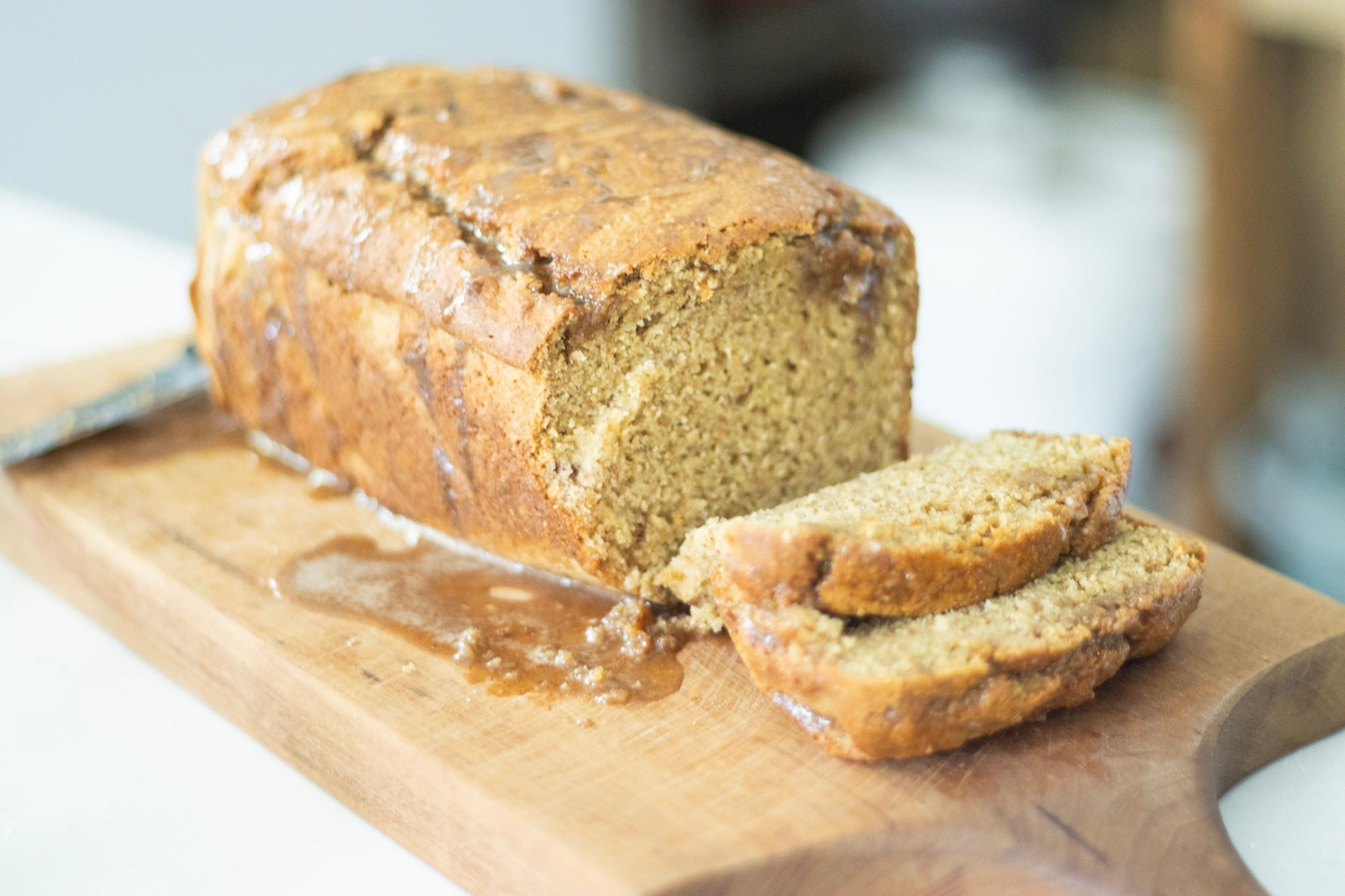 Sourdough pumpkin bread on cutting board with 2 slices cut