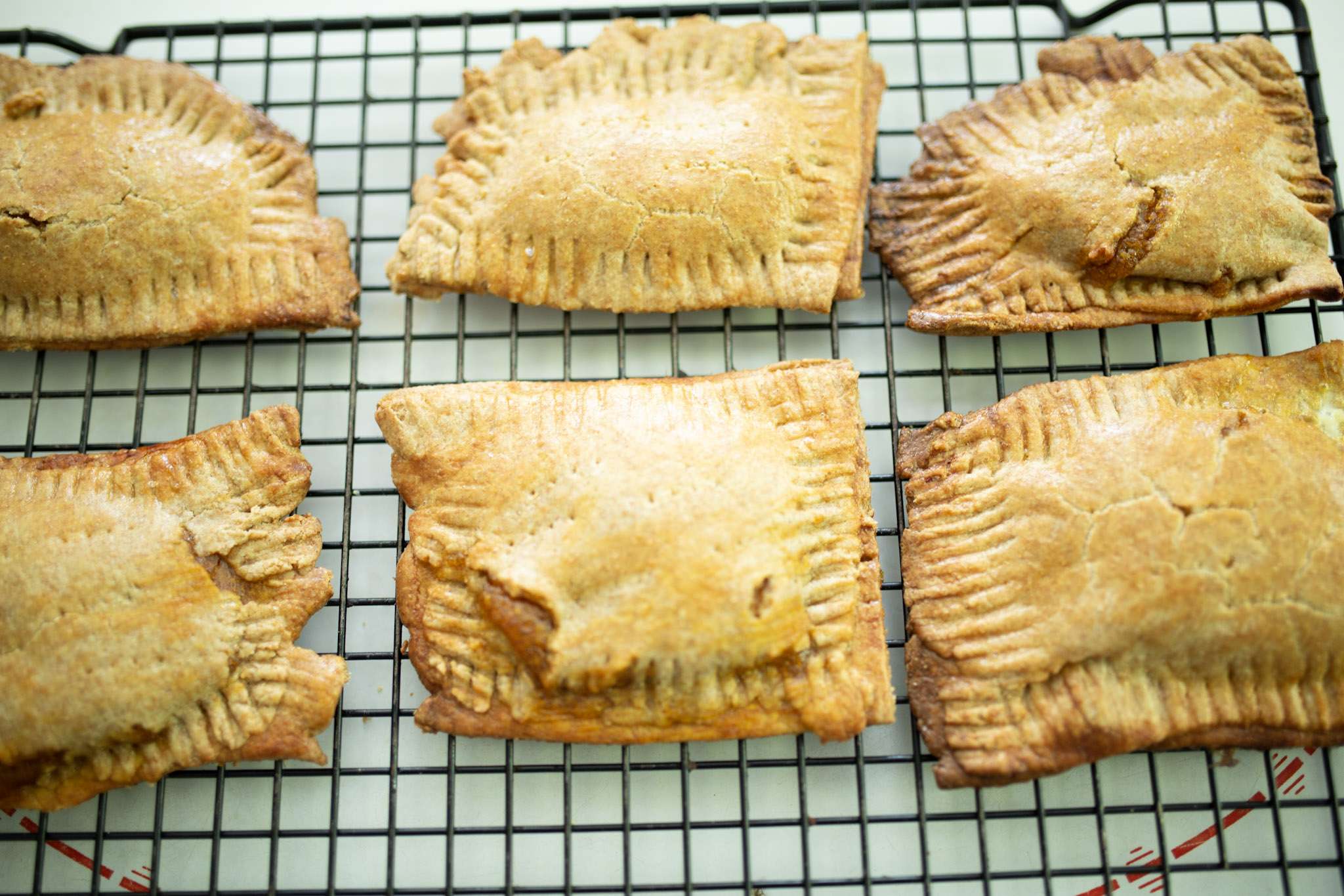 sourdough pumpkin pop tarts on a cooling rack