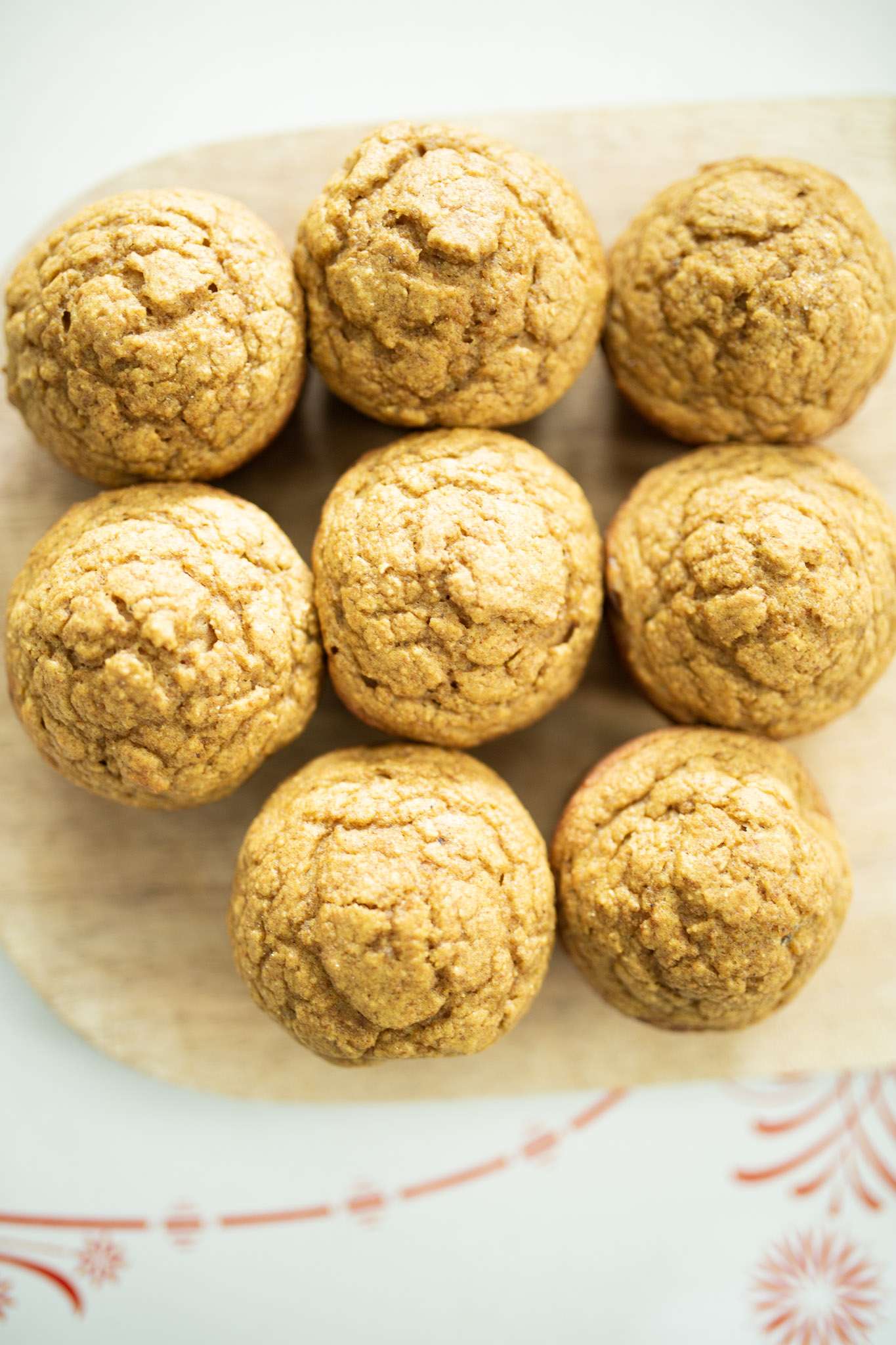 over head shot of sourdough pumpkin muffins on a cutting board