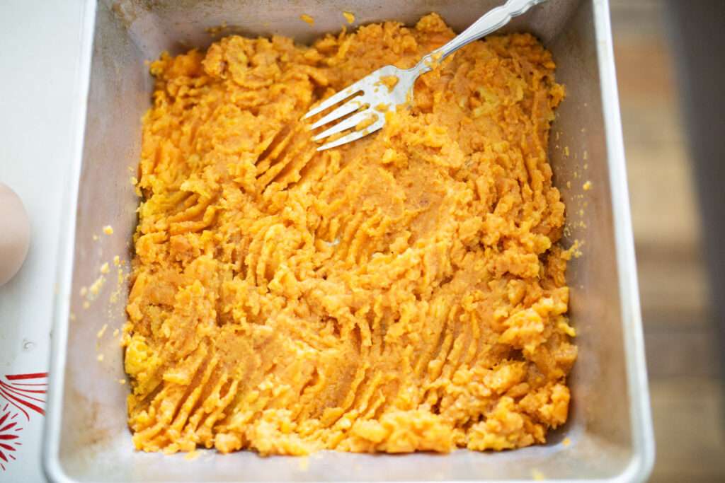 sweet potato casserole filling in baking dish