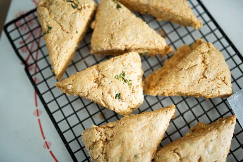close up overhead of sourdough jalapeno garlic scones on a wire rack