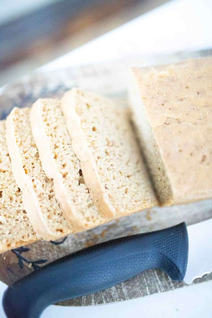 overhead shot of sourdough einkorn sandwich bread sliced on cutting board