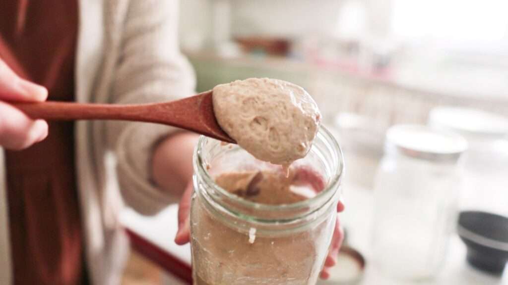 a spoonful of stiff sourdough starter on a spoon