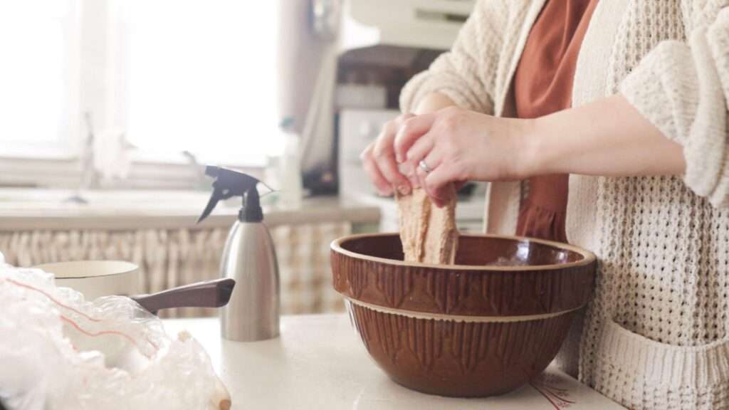 stretching and folding sourdough bread dough made with stiff sourdough starter.