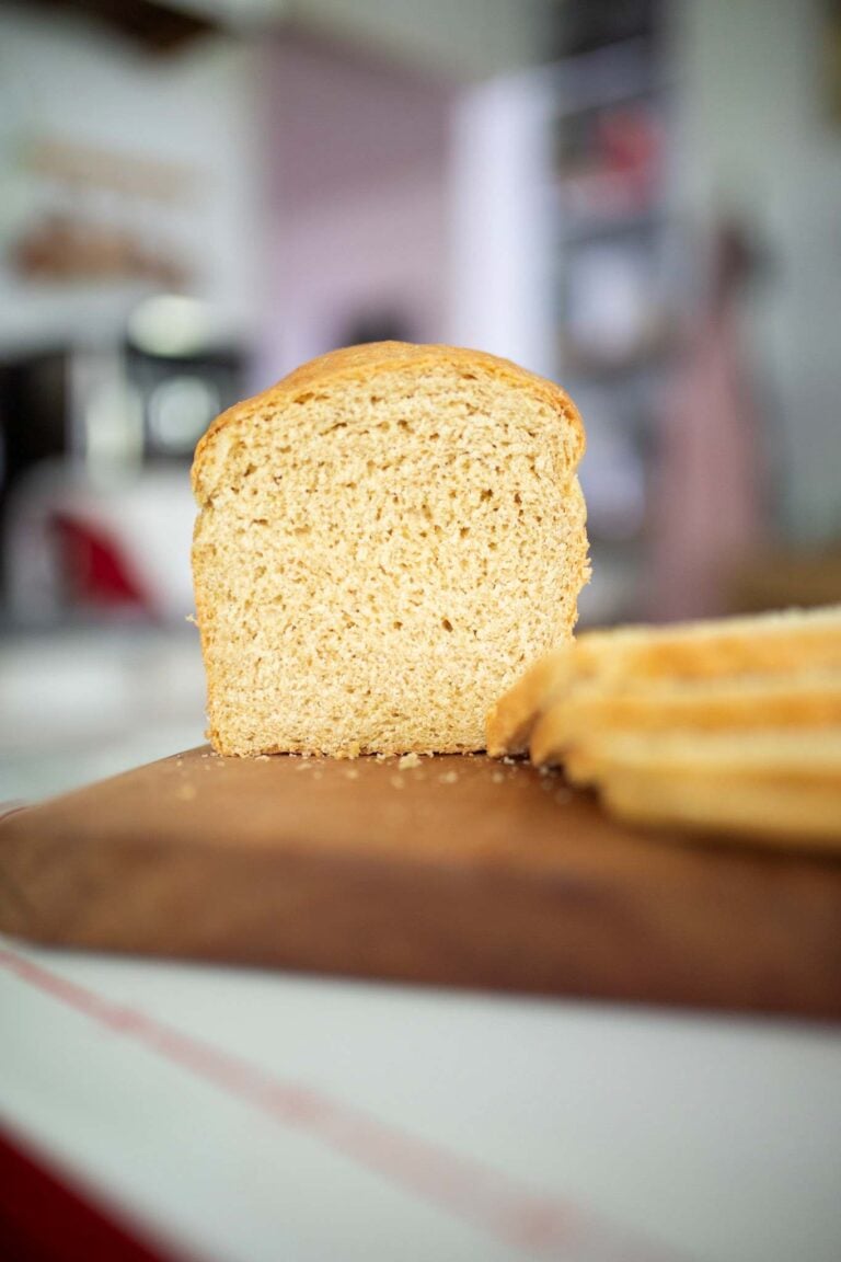 Sliced Khorasan sandwich loaf on a cutting board.
