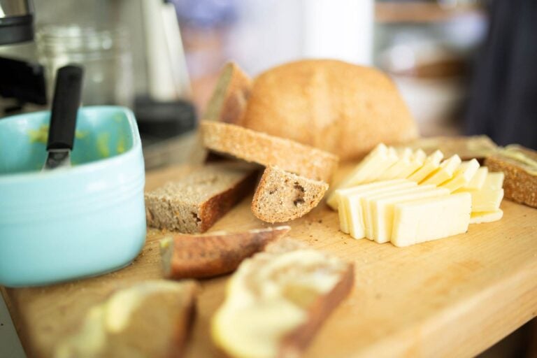 The ingredients for a sourdough grilled cheese are laid out on a cutting board.