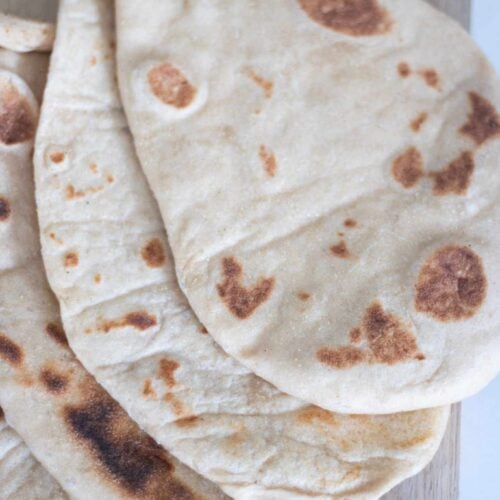 Flatbread are laying on top of each other in a descending stack