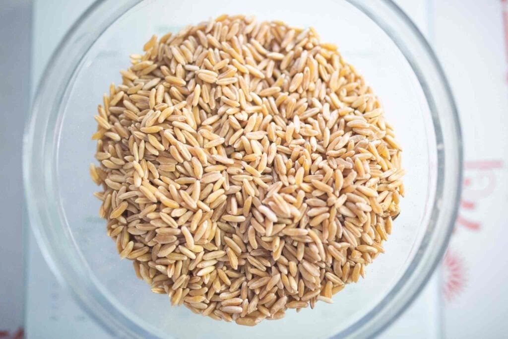 There is a glass bowl full of wheat berries. These are Kamut berries.