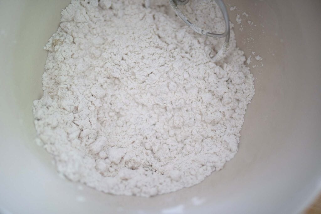 Flour in a cream colored bowl.