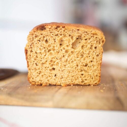 The crumb of a loaf of bread that is sitting on a cutting board.