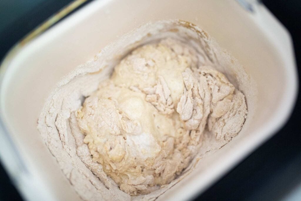 This is a dry dough in a pan that still has dry bits of flour on it.