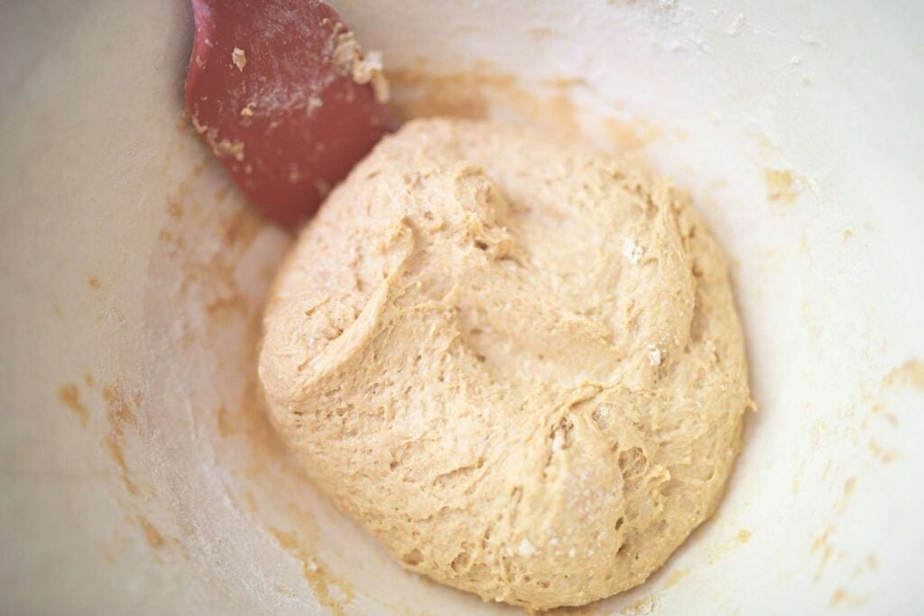 A tacky dough ball in a cream colored bowl