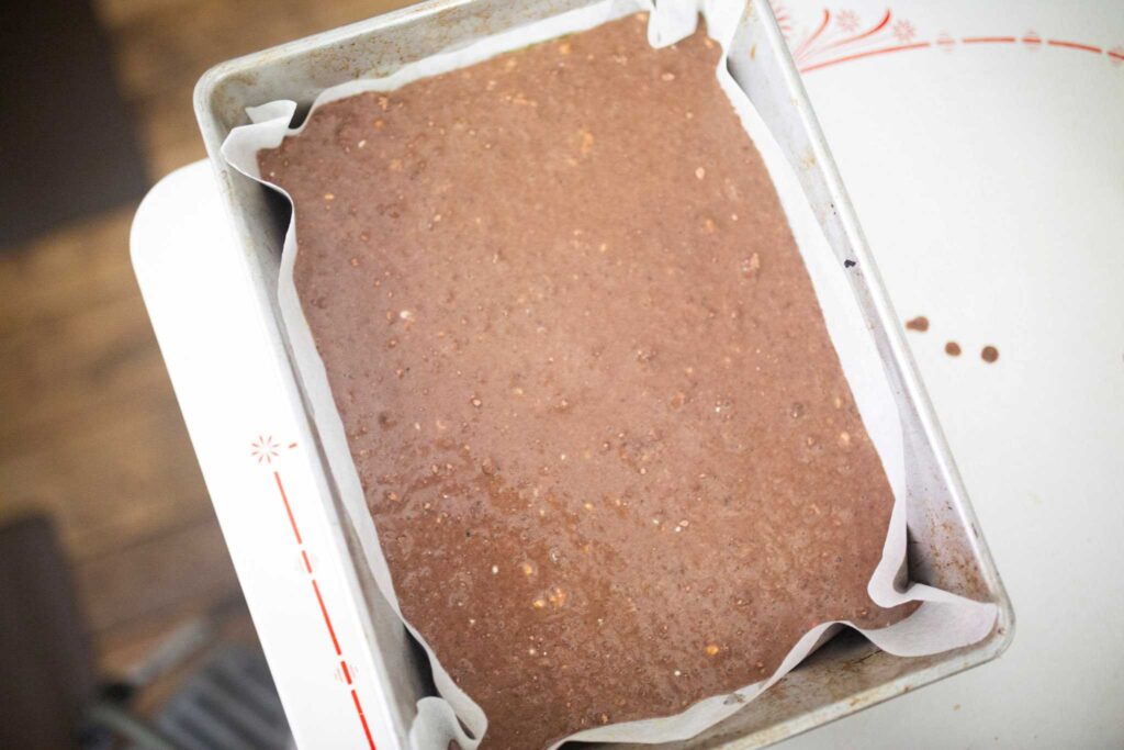 chocolate cake batter in sheet pan.