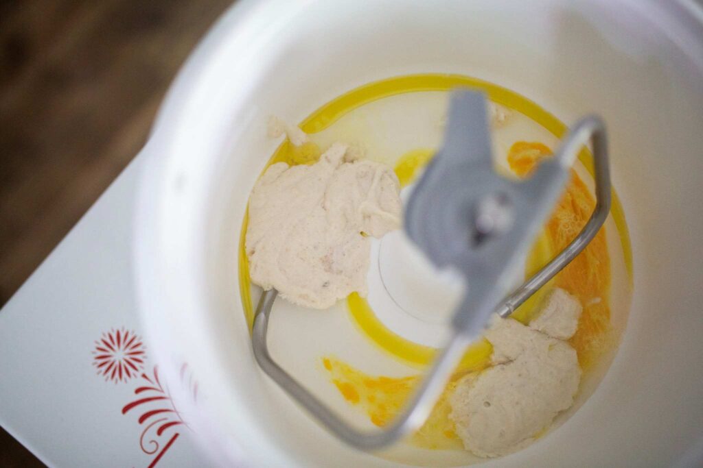 Wet ingredients are in a stand mixer bowl.